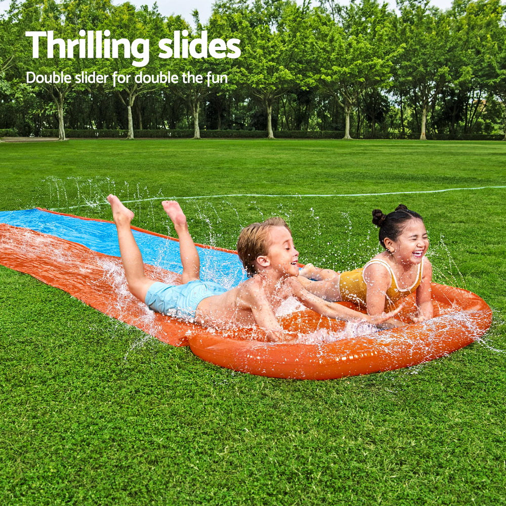 Orange inflatable splash pool with blue slide lane, two kids playing with water
