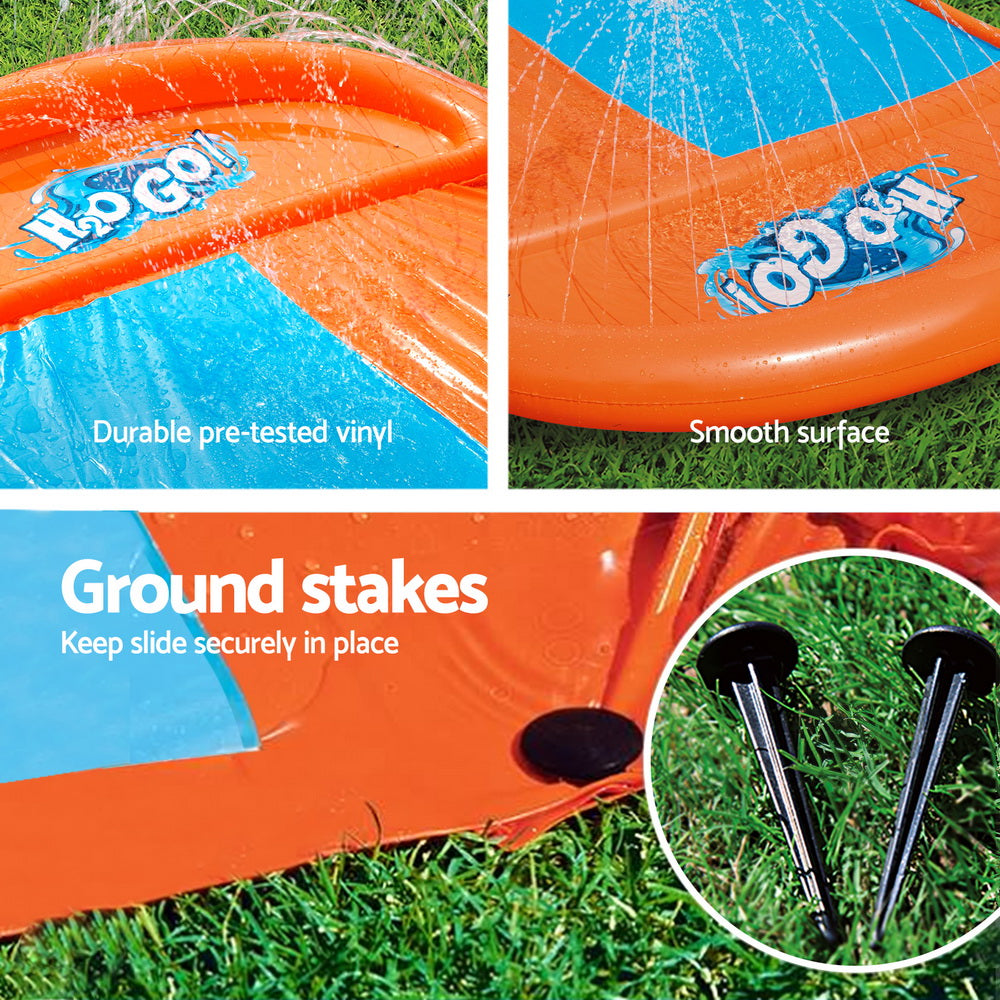 Orange and blue inflatable slide close-up, smooth surface and water channel