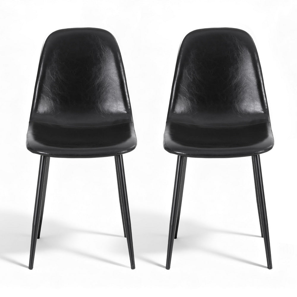 Pair of black dining chairs with curved backs, thick upholstered seats, slim metal legs