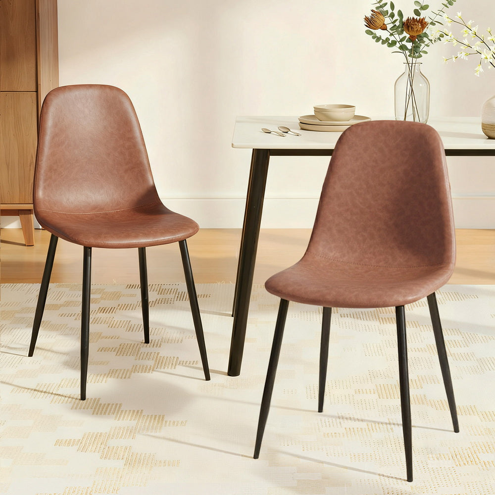 Brown upholstered dining chair with curved back and seat, black metal legs