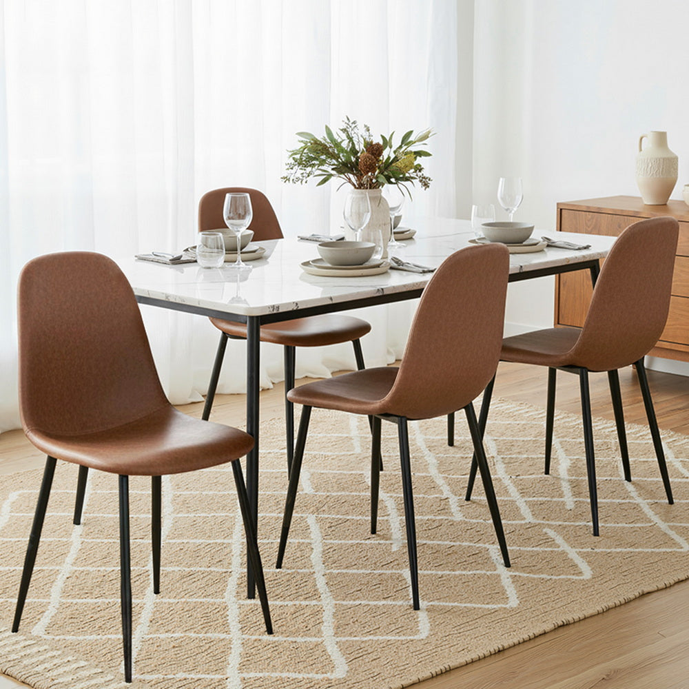 Brown upholstered dining chairs with curved backs and slim black metal legs.