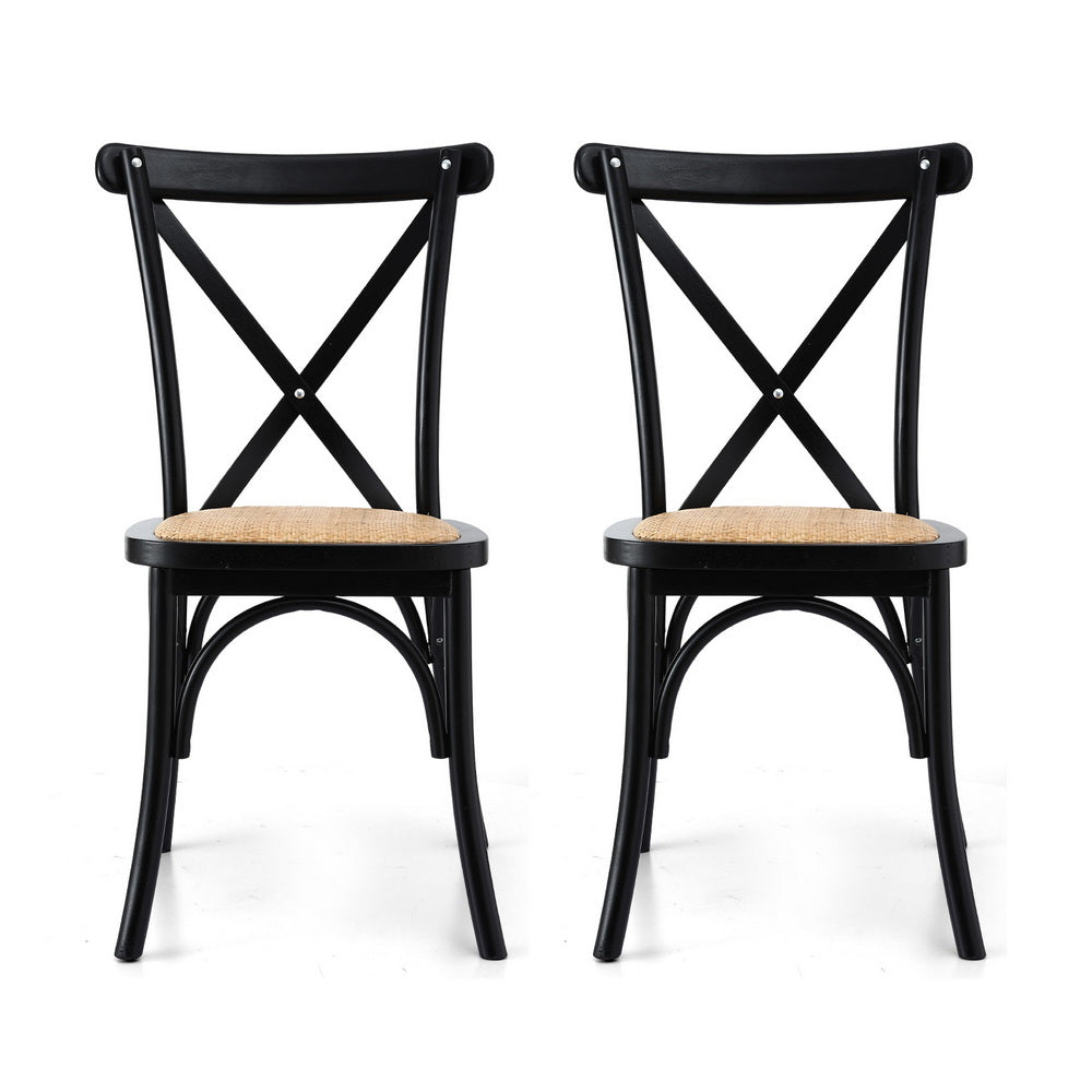 Pair of dining chairs with black X-back frames and woven rattan-style seat tops.