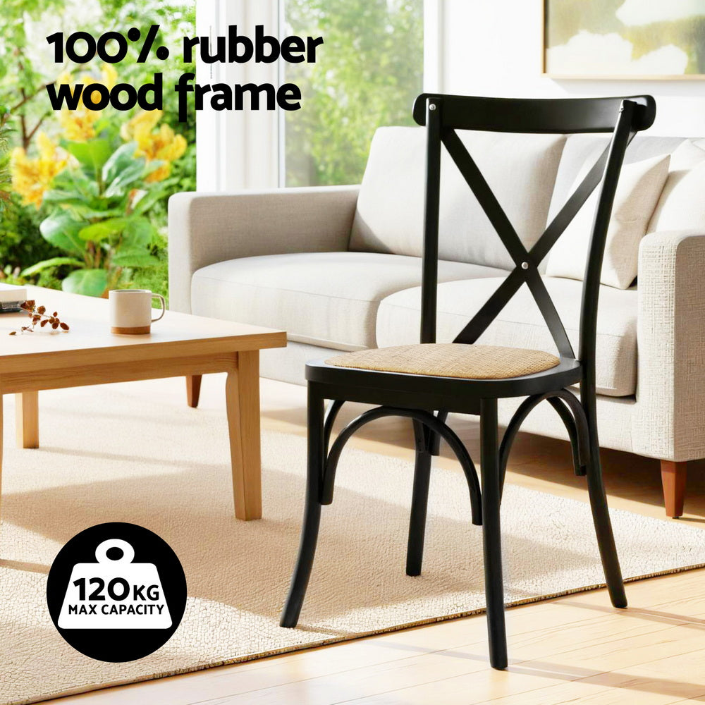 Dining chair with black frame and woven rattan-style seat.