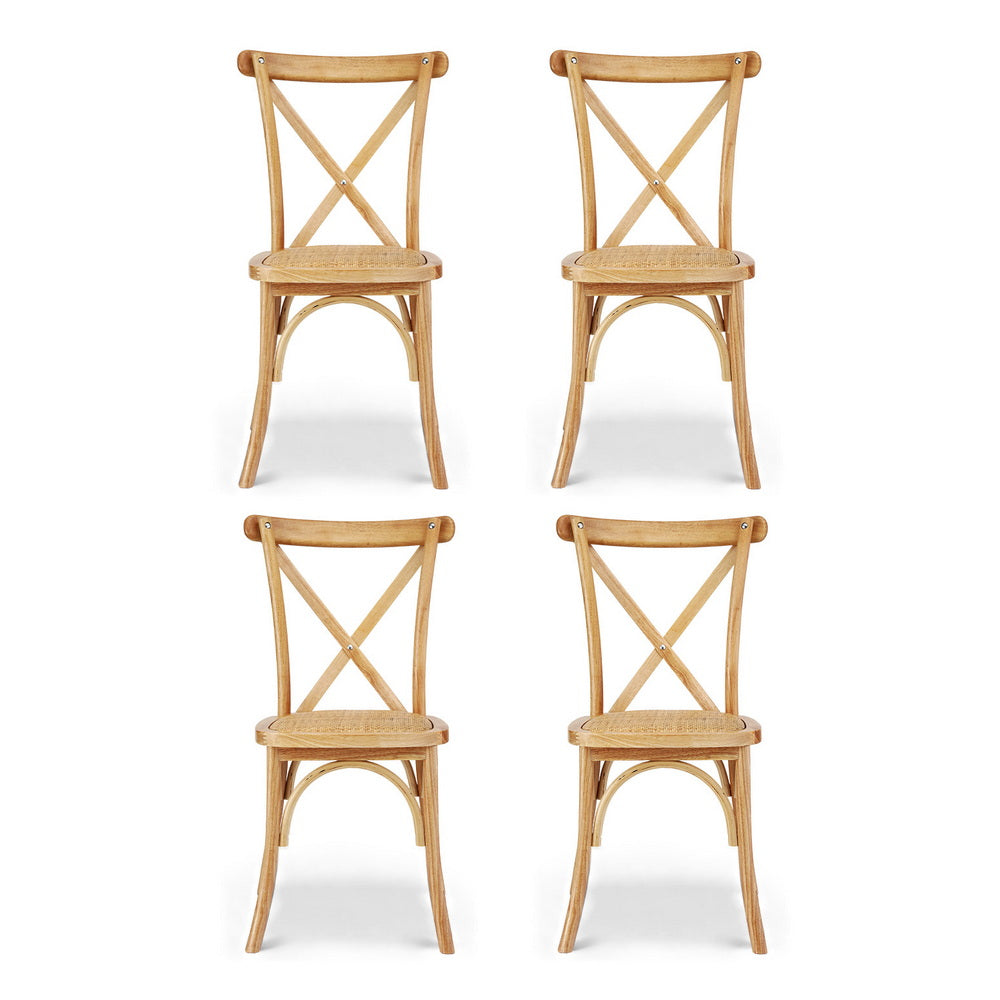 Four wooden dining chairs with cross-back panels and woven rattan round seats