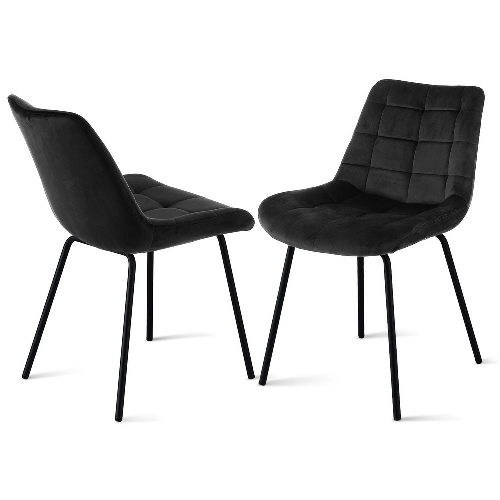 Black velvet dining chair with tufted square back, curved seat, and black metal legs.