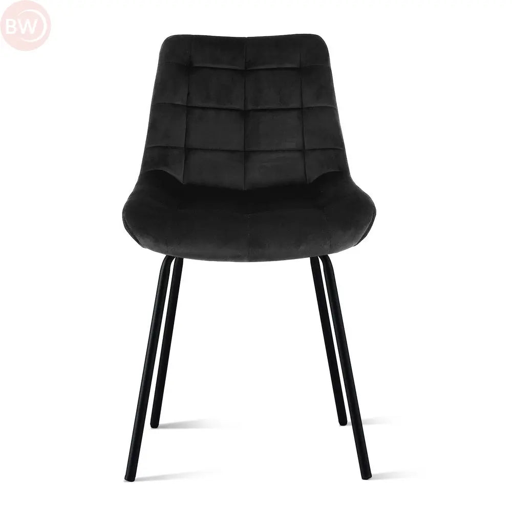 Black velvet tufted dining chair with high backrest and tapered metal legs