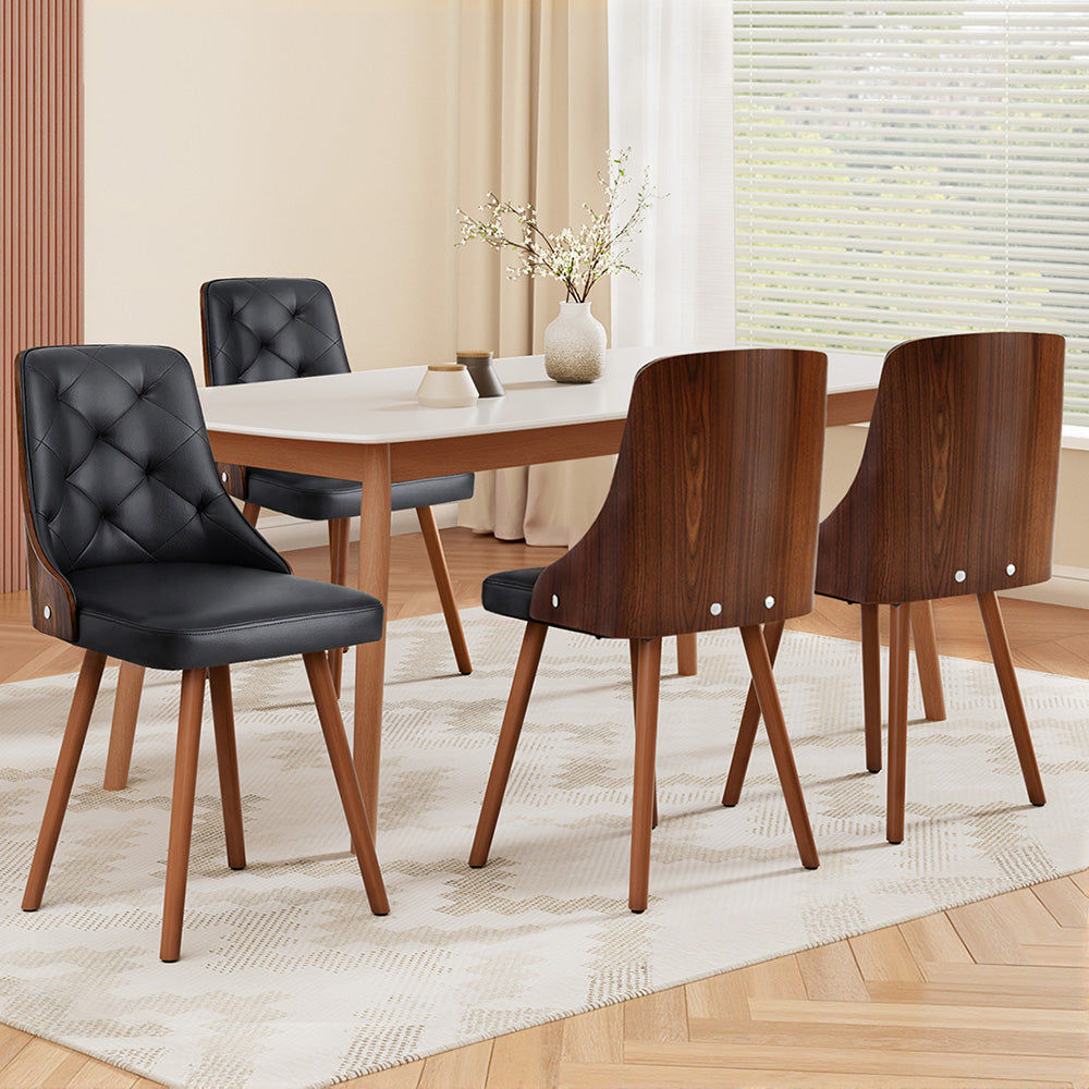 Set of black PU dining chairs with diamond tufted backs and wooden legs