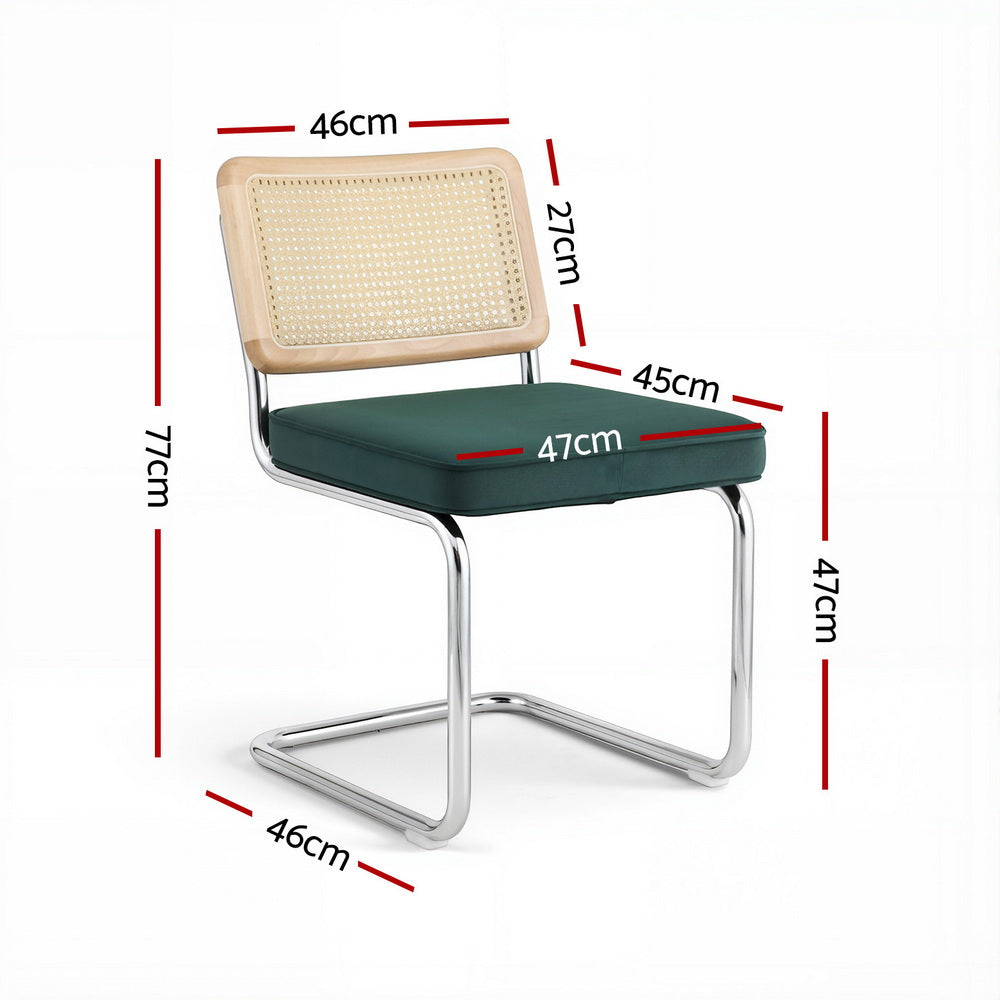 Cantilever dining chair with dark green upholstered seat, rattan back, chrome legs