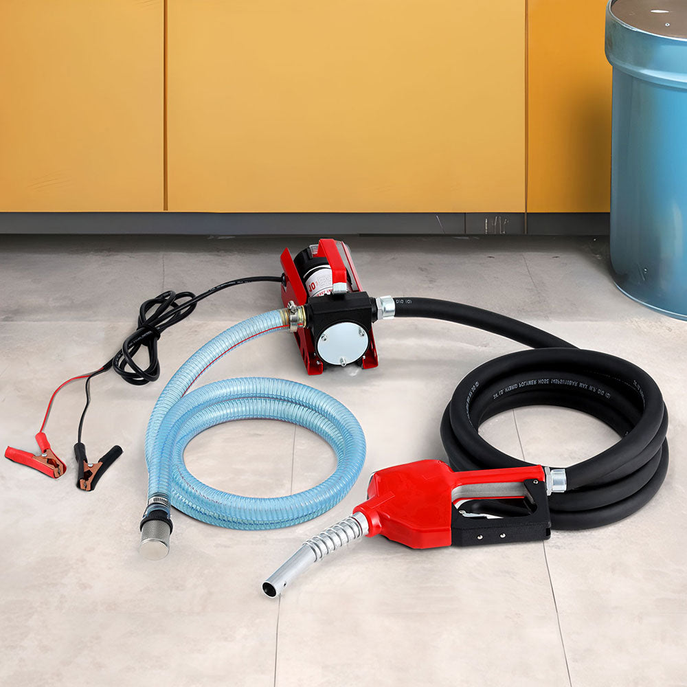 Fuel transfer pump kit with red nozzle, blue outlet hose, black inlet hose and power leads