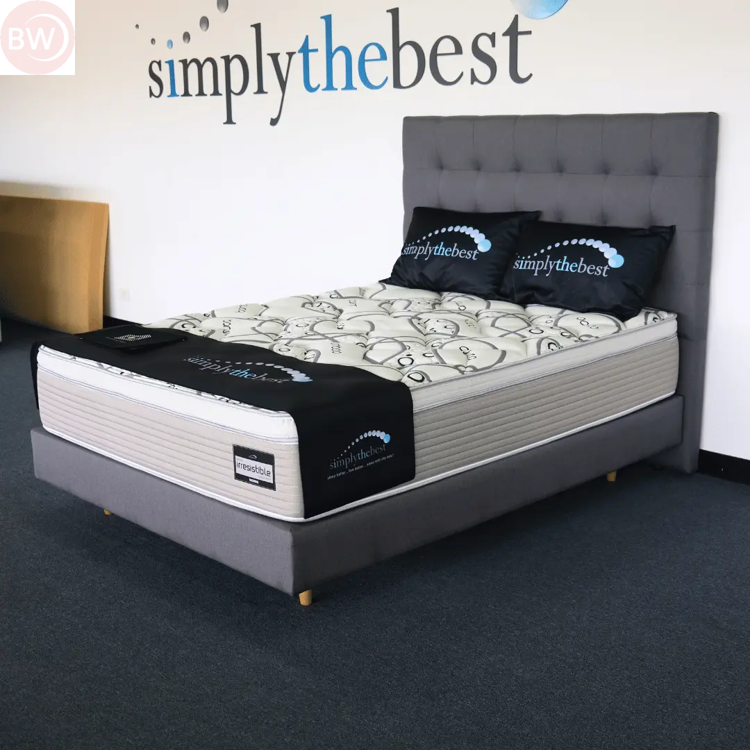 Plush mattress on grey ensemble base with patterned white-and-grey cover