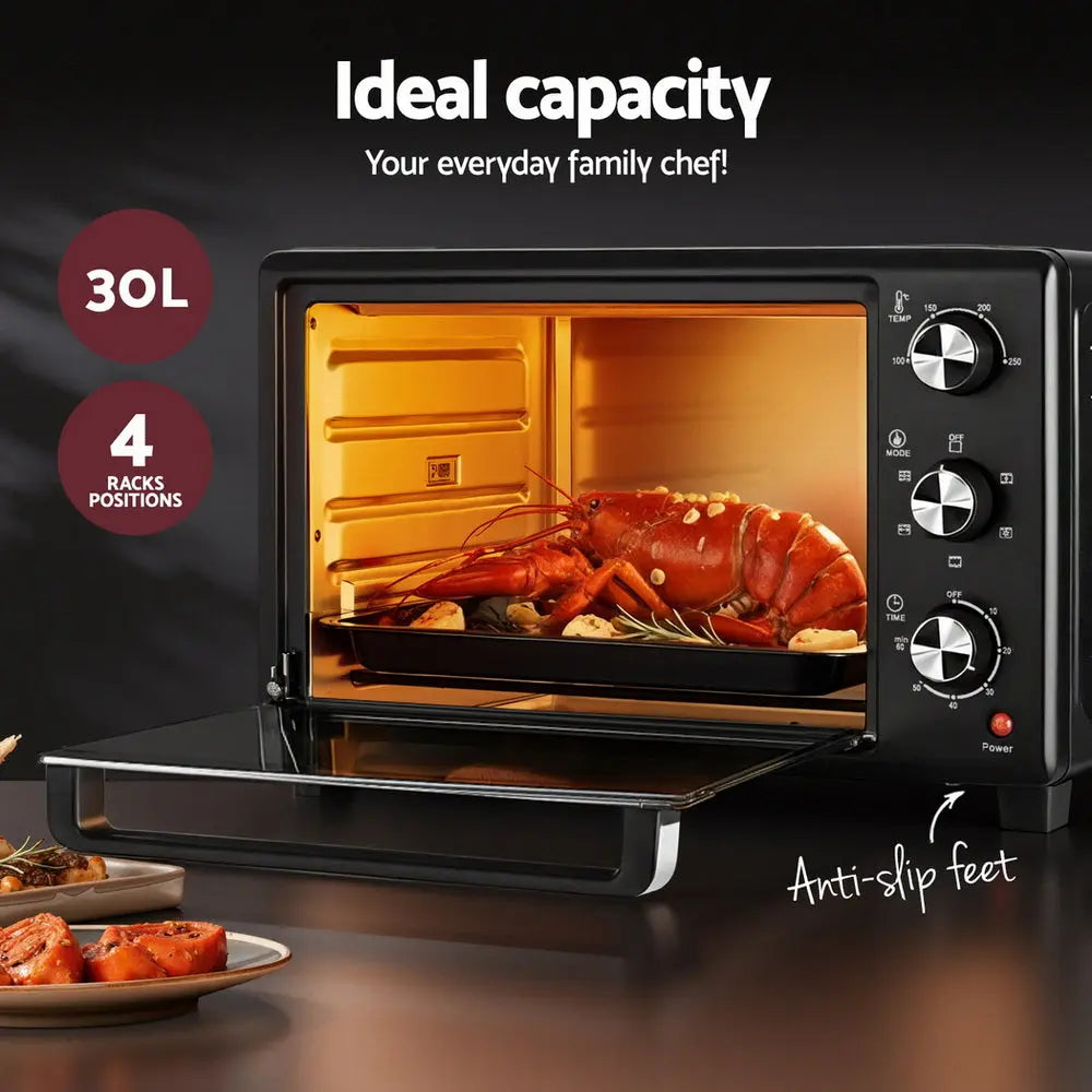 Electric convection oven with door open and roast chicken inside, black exterior, three control knobs