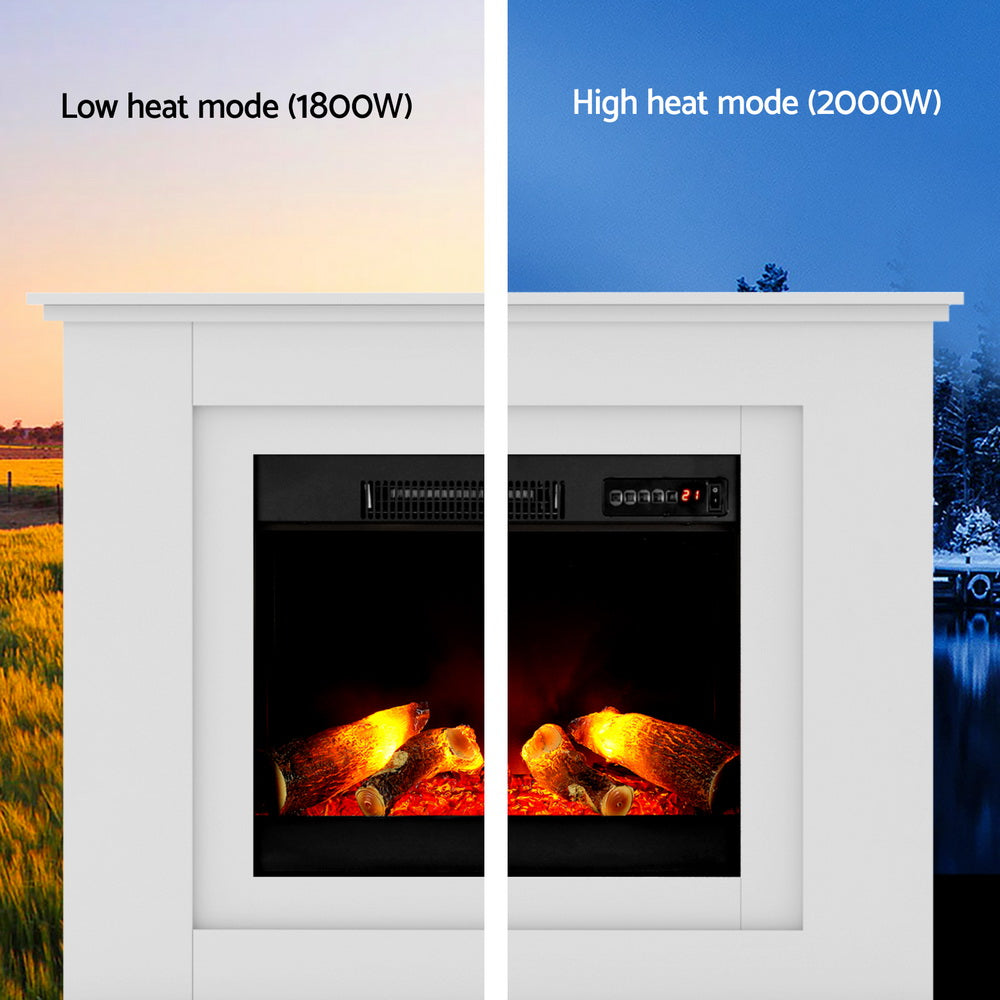 White electric fireplace heater showing flame and heating modes on the display.