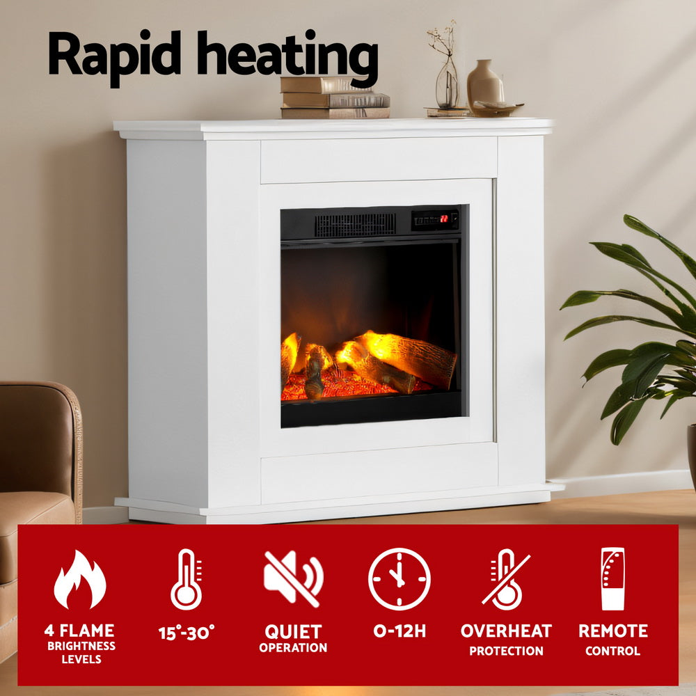 White electric fireplace heater with flame display in a living room setup.