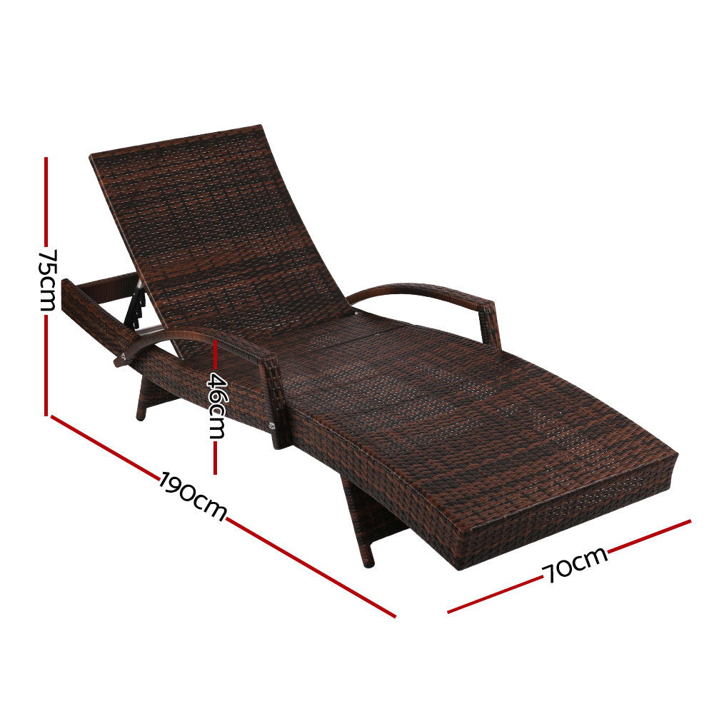 Pair of dark brown wicker adjustable chaise loungers with cream cushions and side armrests