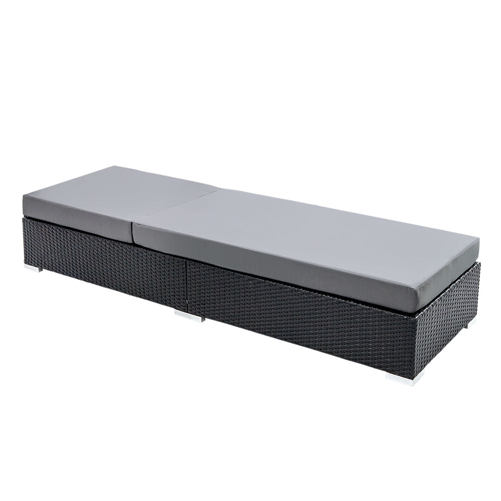 Black wicker daybed lounger with two-piece light gray cushions, split-back layout