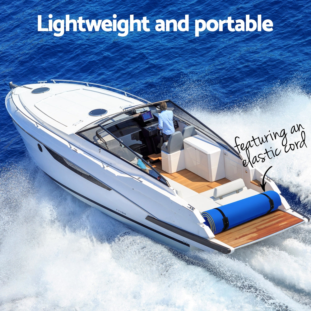 Blue foam water mat folded on boat deck beside seating