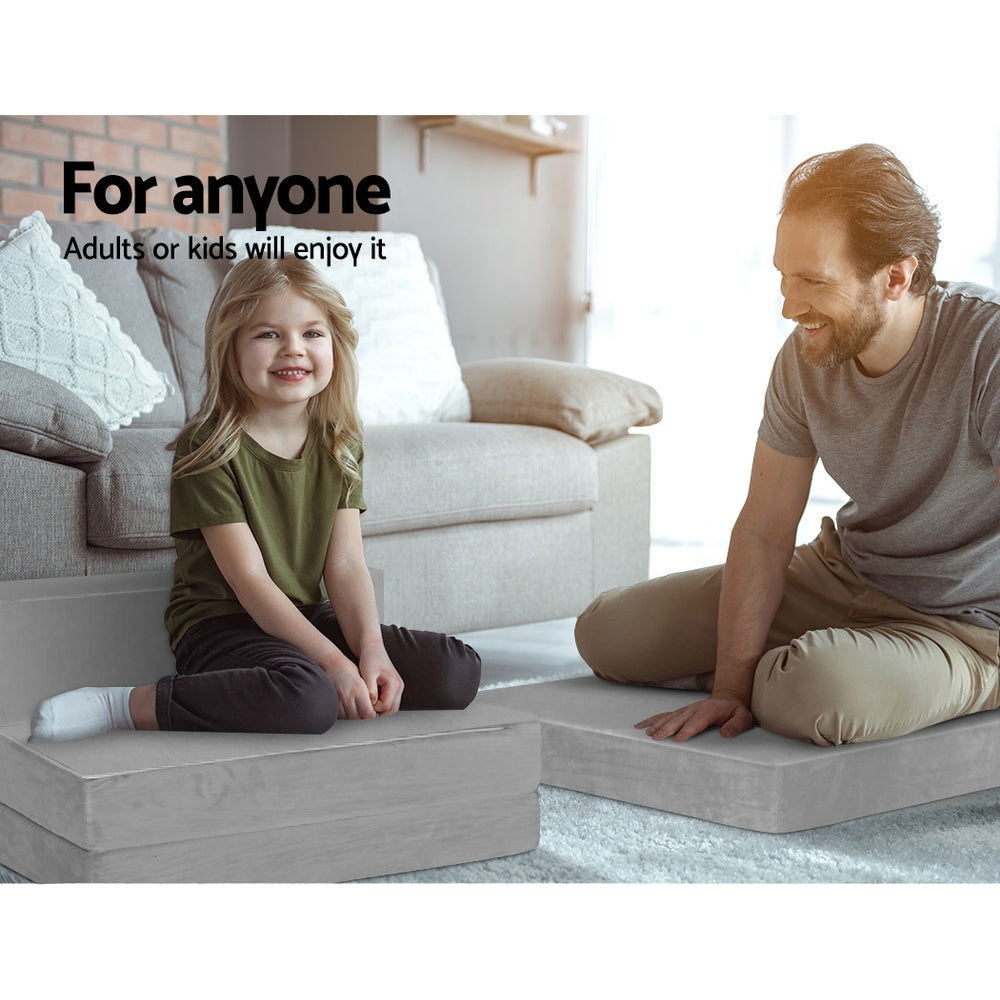 Light grey foldable foam mattress mat unfolded into low seating blocks