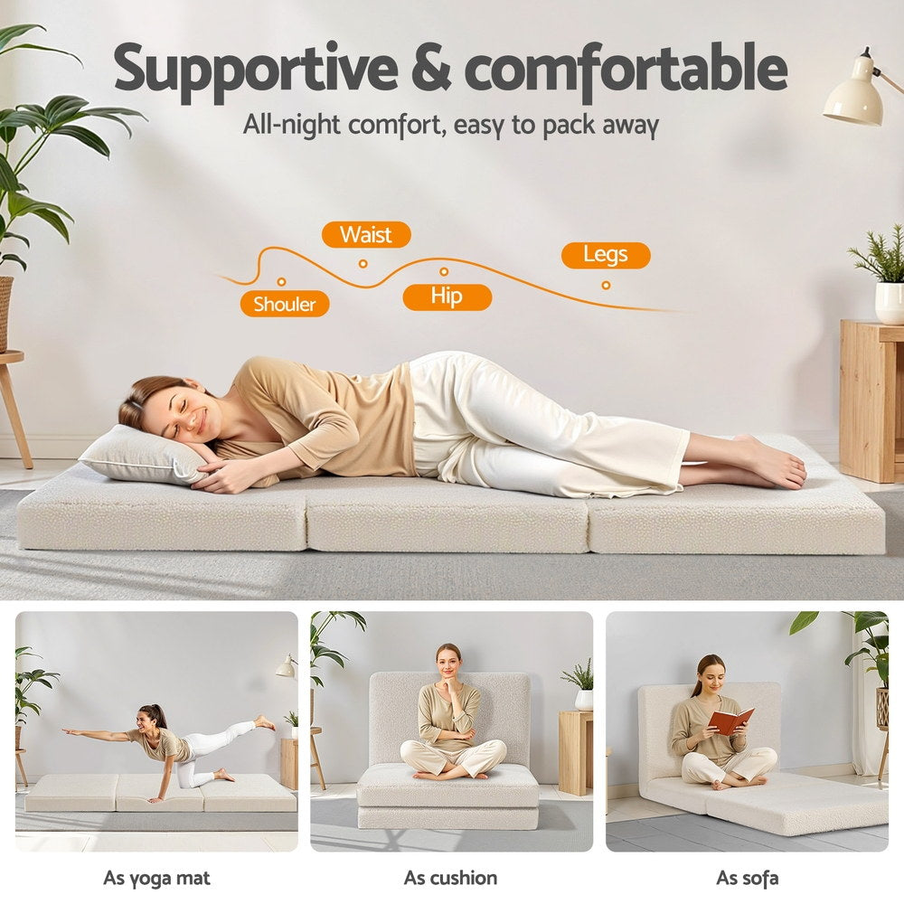 Folded 3-panel portable foam mattress laid out flat with a light beige fleece top.