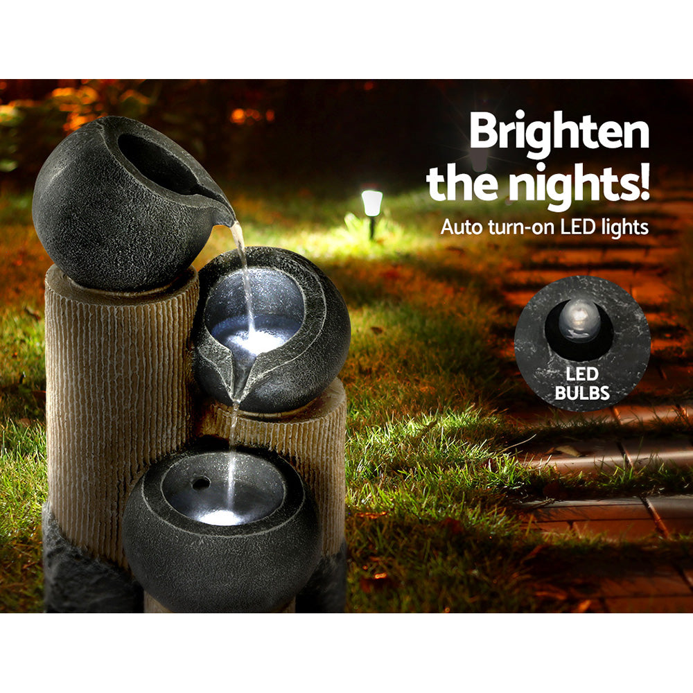 Grey 3-tier cascading fountain with water streams and integrated LED lighting
