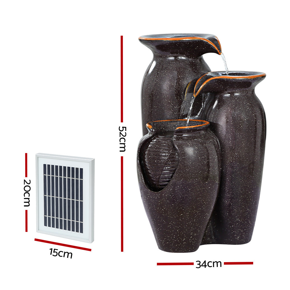 Grey resin cascading fountain with three urns and attached solar panel pump unit