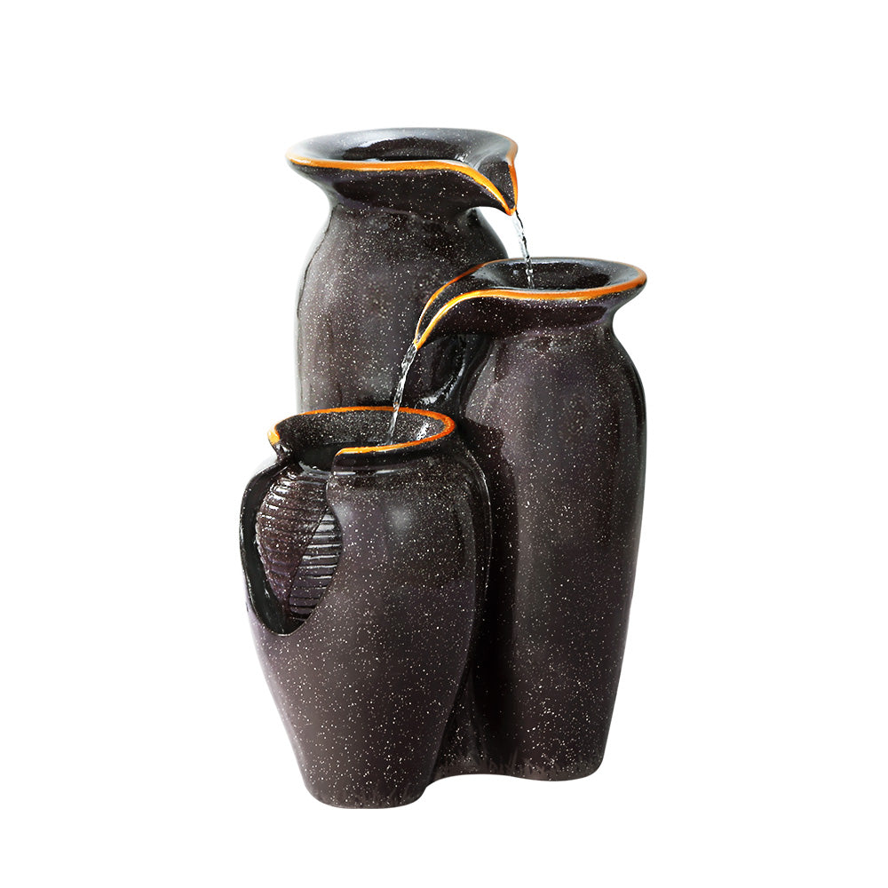 Three-urn grey resin cascading fountain with small streams of water