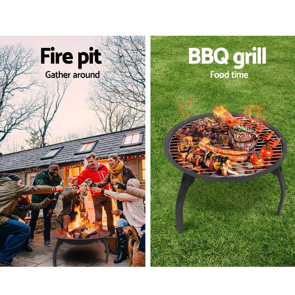 Outdoor portable fire pit and BBQ grill with burning coals and food