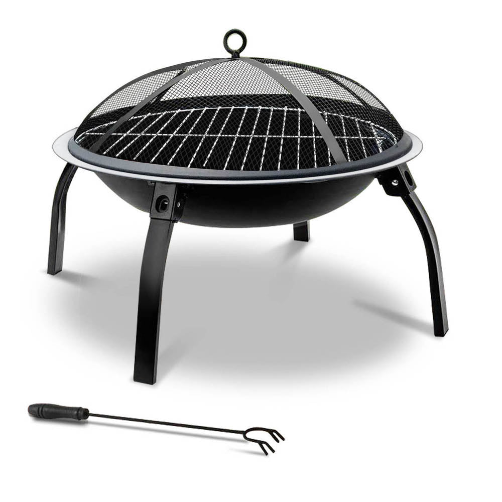 Charcoal BBQ fire pit grill with round mesh dome, three legs, and included tool