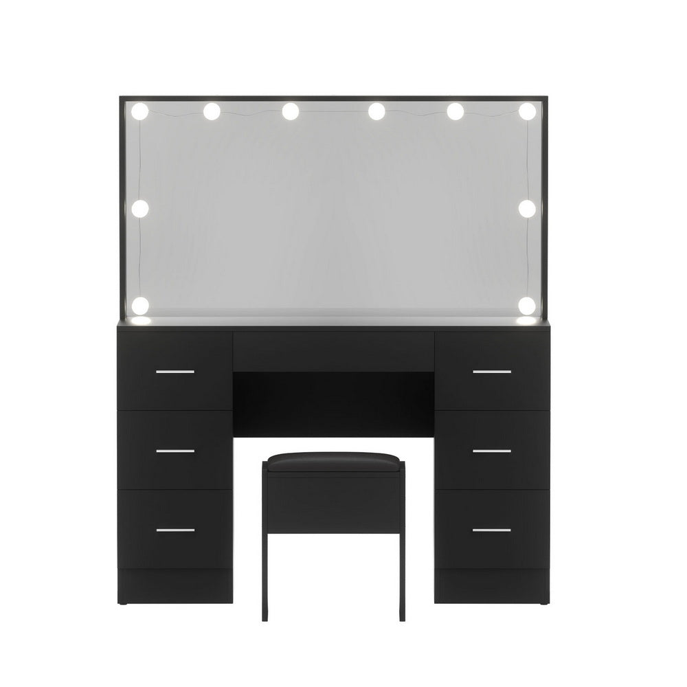 Black dressing table vanity with lit mirror and side drawers, plus cushioned stool