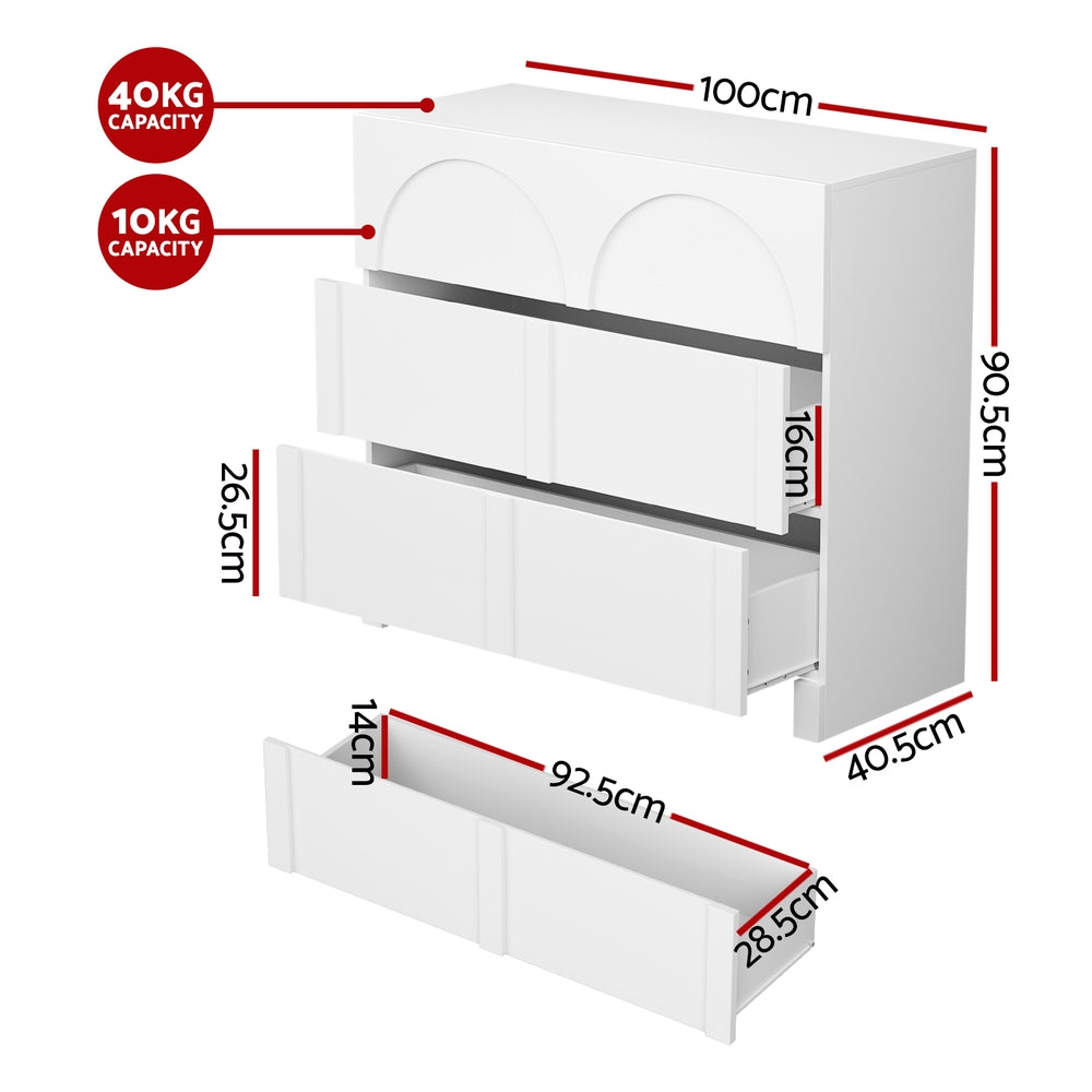 White lowboy dresser showing open drawer bay and three arched front panels, angled view