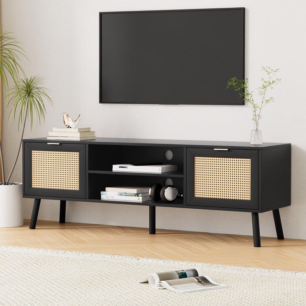 Black TV storage cabinet with two rattan-look doors, central shelf, and angled legs