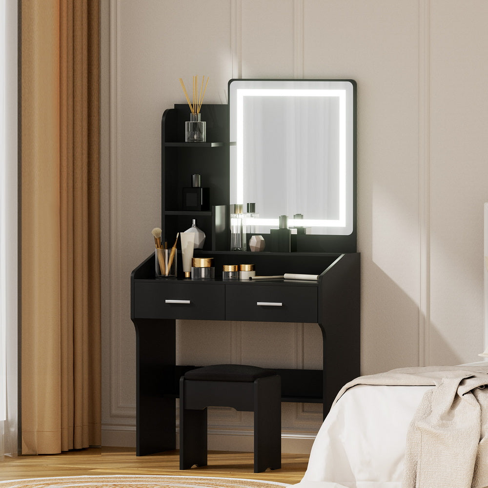 Black dressing table set with LED mirror, drawers, open shelves, and cushioned stool