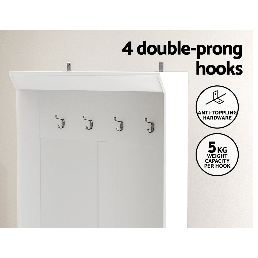 White hall tree cabinet with four double-prong coat hooks above the doors