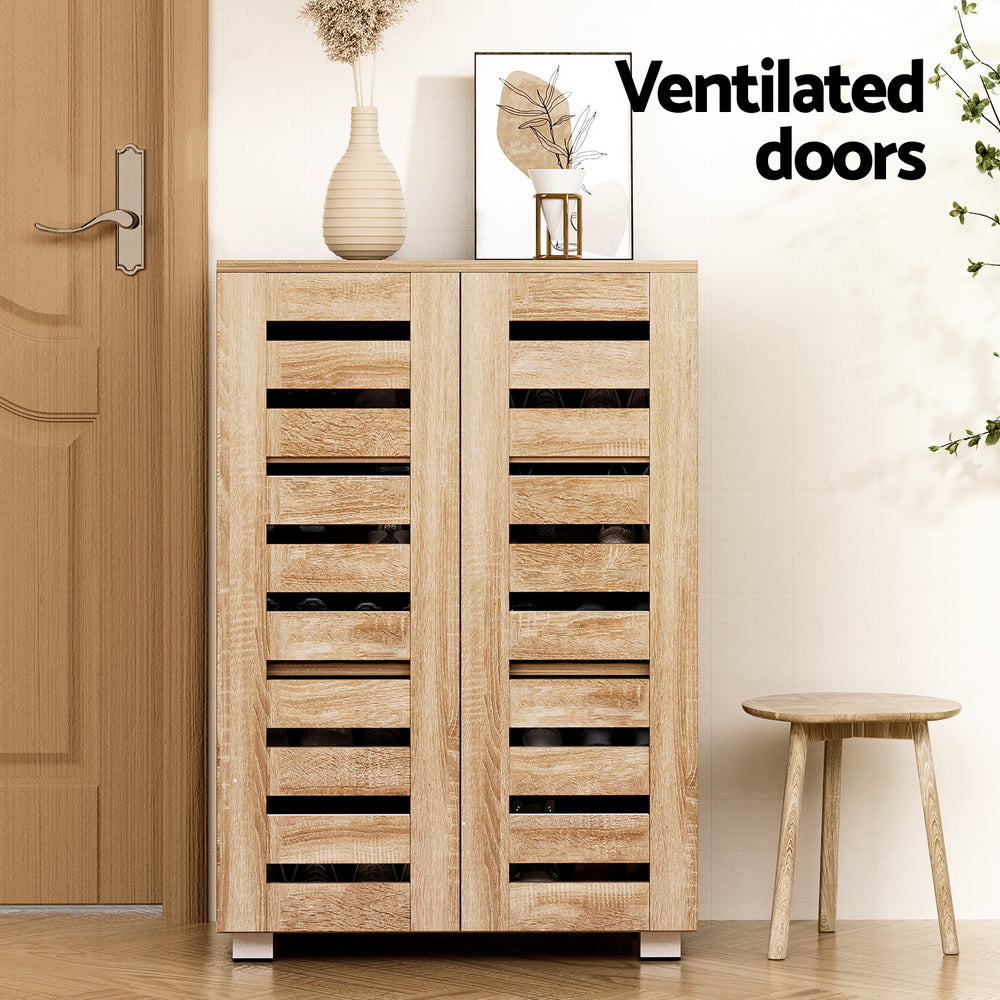 Wood shoe rack cabinet with ventilated doors and five-tier interior shoe shelves.