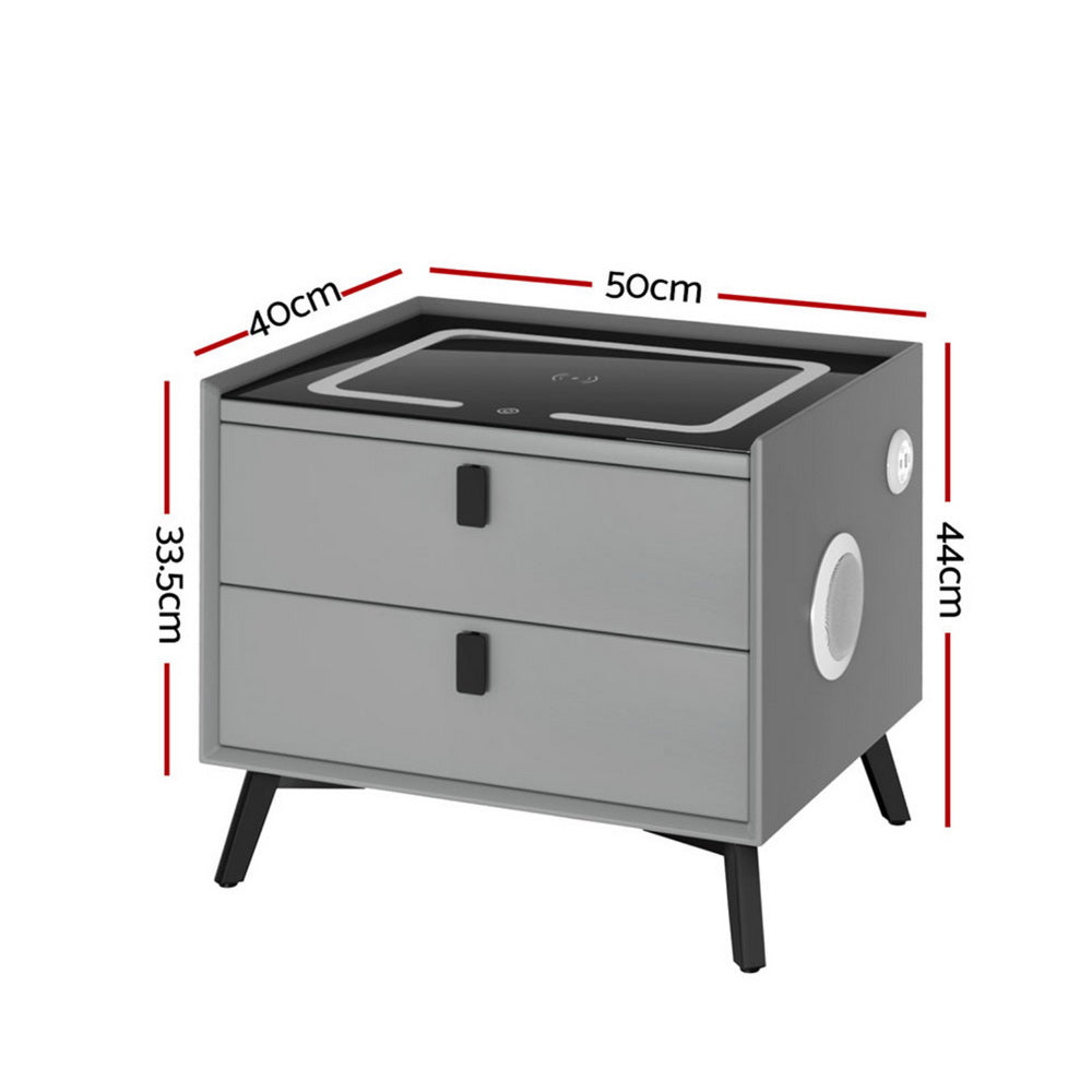 Grey bedside table with 2 drawers, side speaker panel, and charging pad