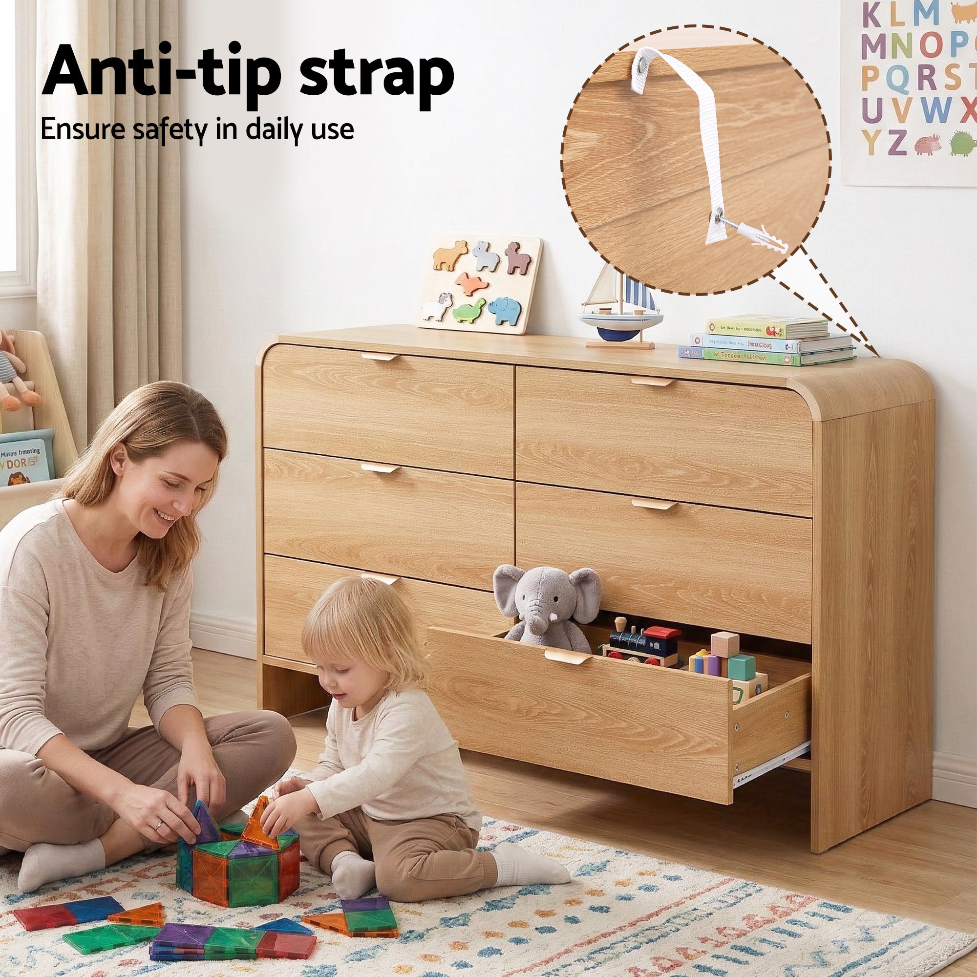 Light pine 6-drawer dresser cabinet with anti-tip strap, shown in a child play area