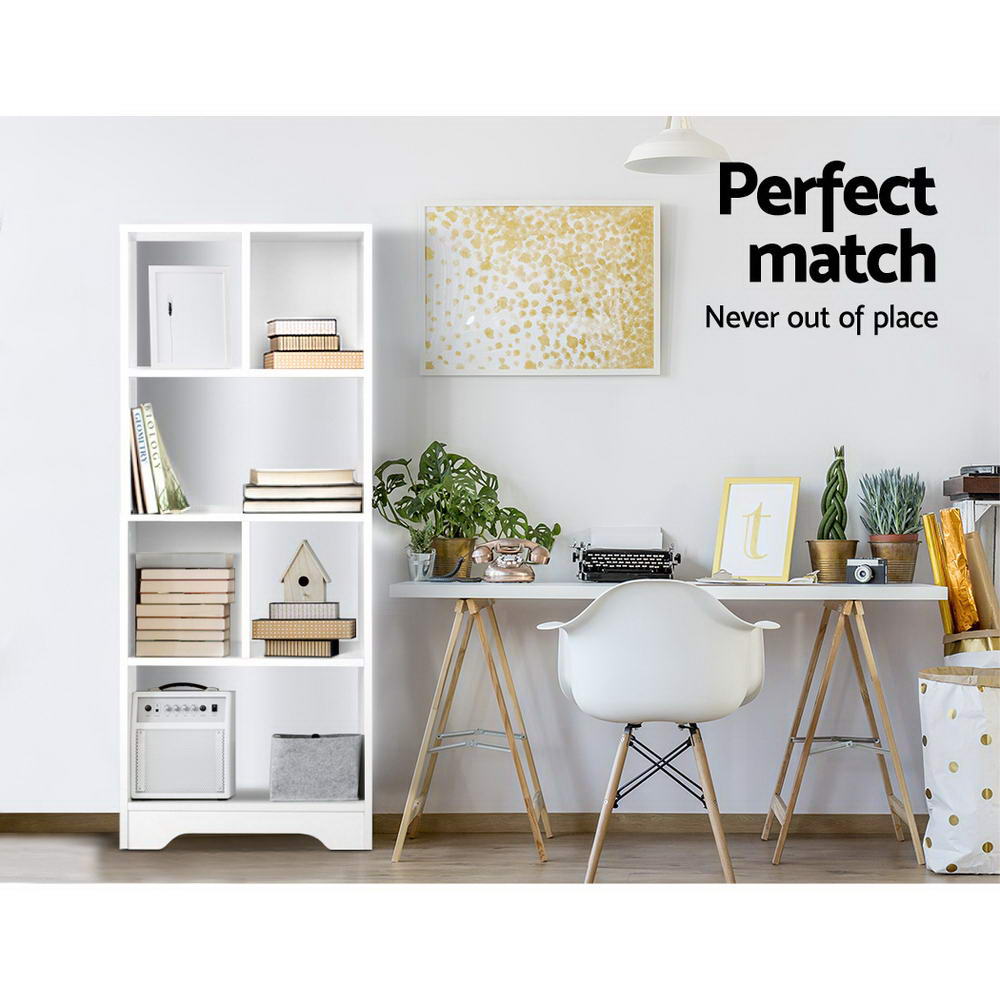 White open bookshelf displaying books, storage bins, and small decor items