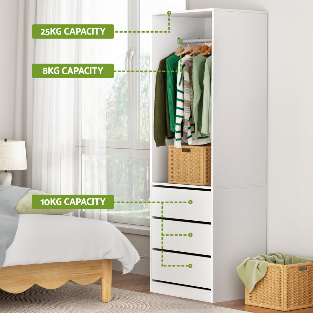 White wardrobe cabinet with hanging rail and three drawer storage sections
