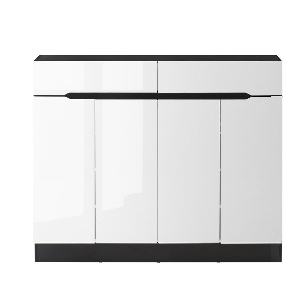 White shoe rack cabinet with drawer, black base and top panel, four door fronts