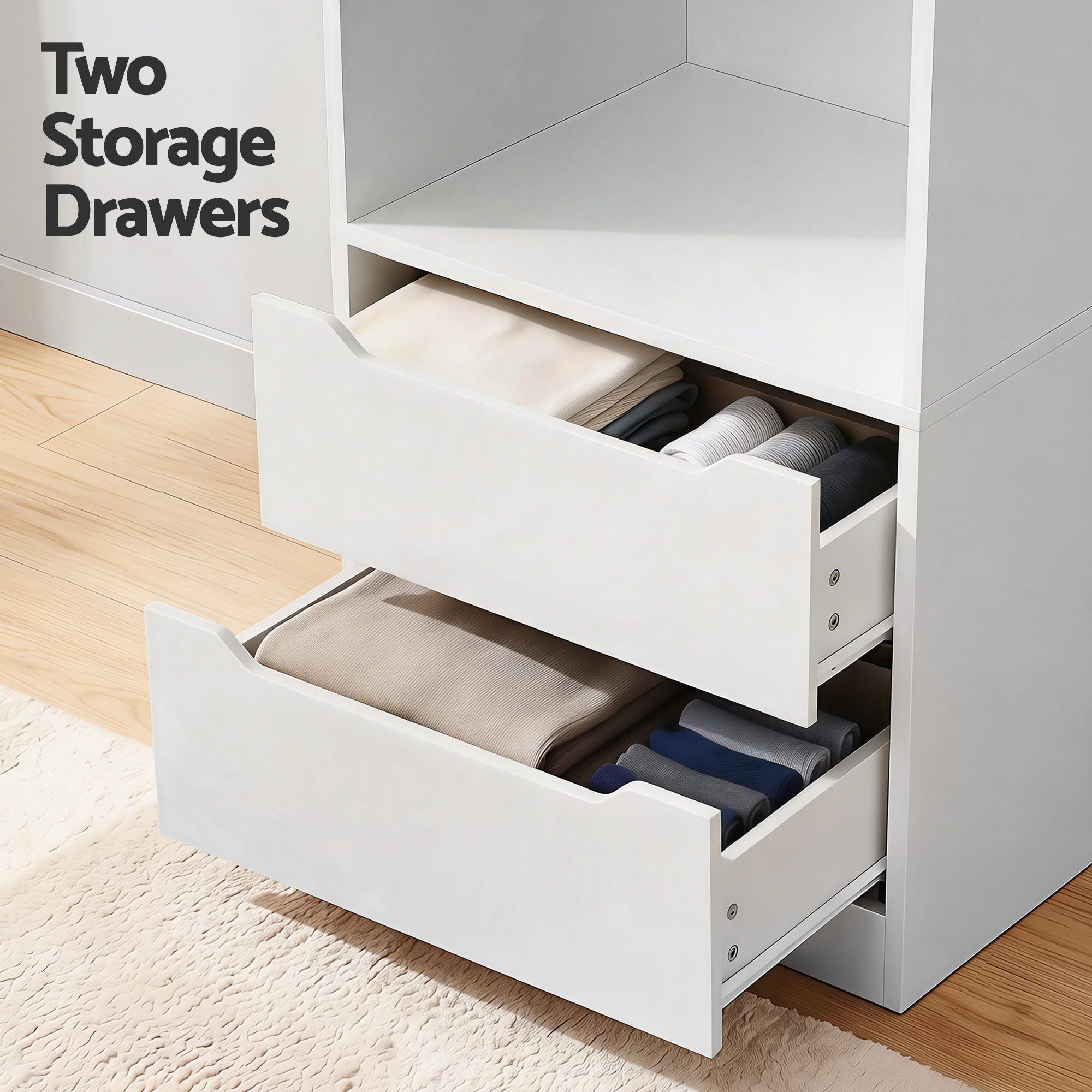White wardrobe drawers open with folded clothes and interior dividers