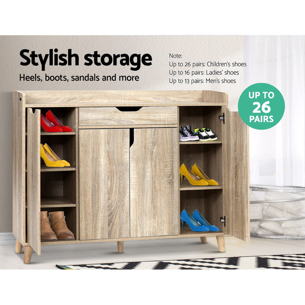 Shoe rack cabinet with open side doors showing shoe compartments, light oak finish