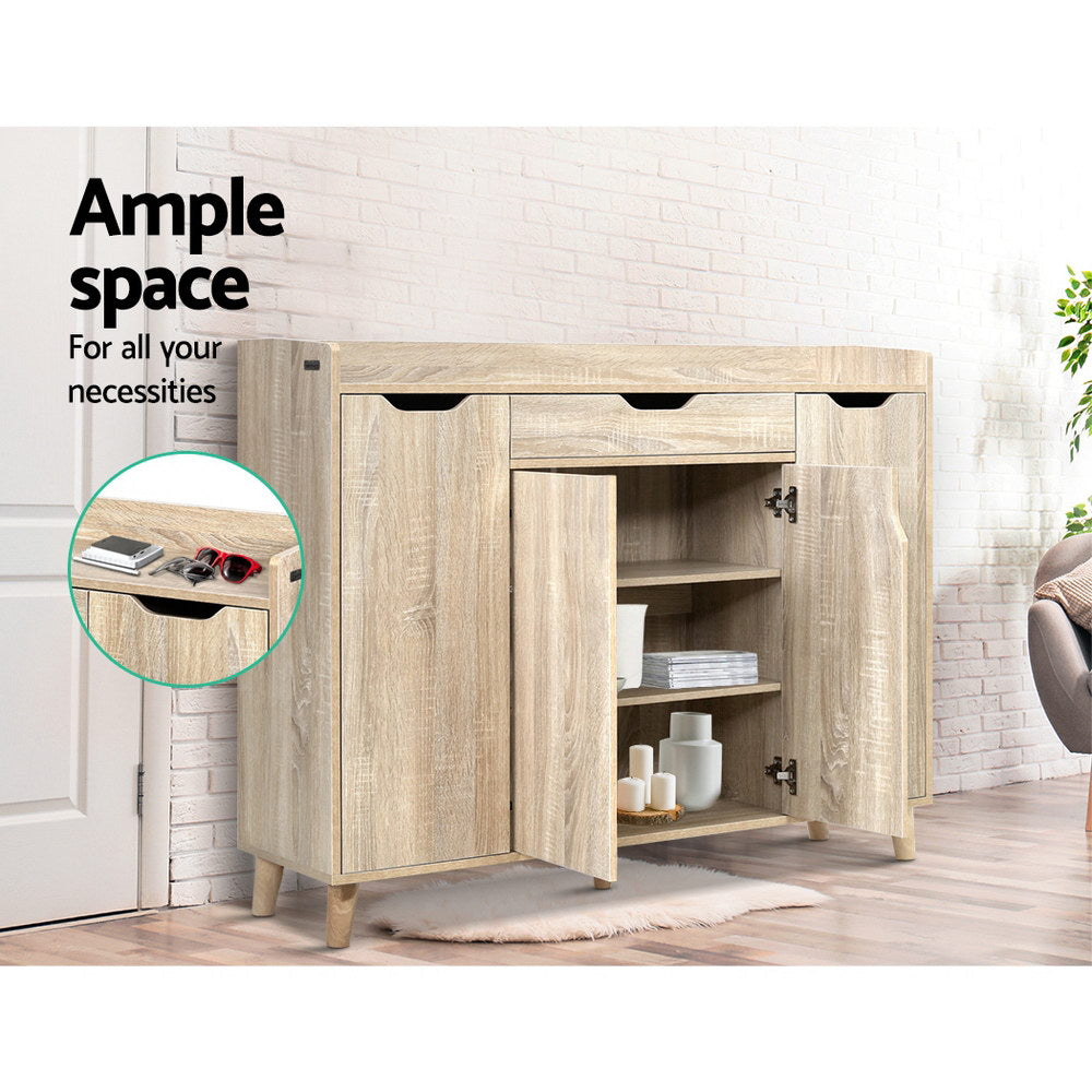 Shoe rack cabinet with open doors revealing shoe compartments, light oak finish
