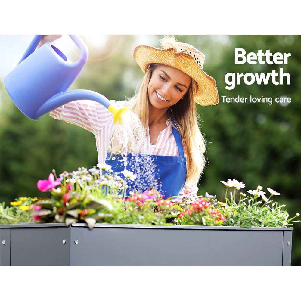 Elevated dark gray planter box with flowers, top edge visible in use