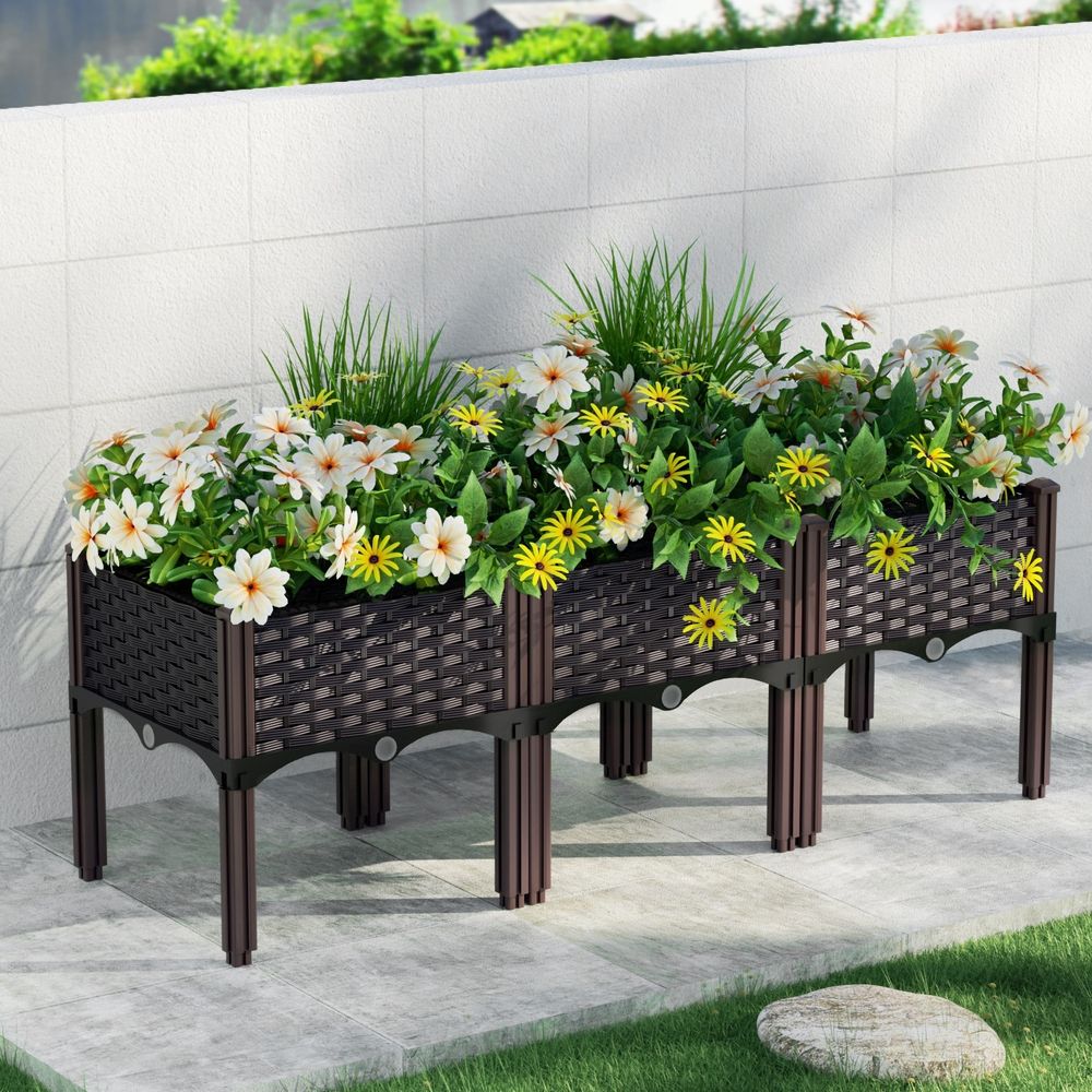 Garden planter box with woven sides and decorative flowers, dark brown, raised legs