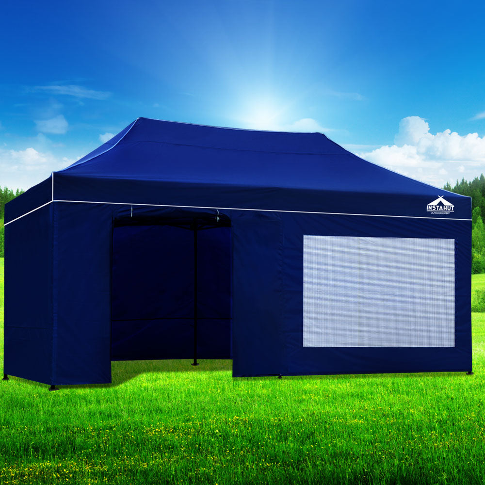 Blue pop-up gazebo with open front doorway and light mesh side window panel