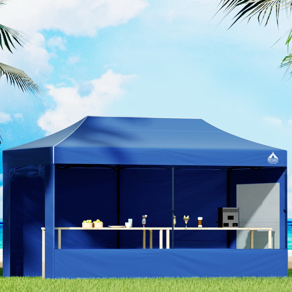 Blue pop-up gazebo with open front and white side window panel