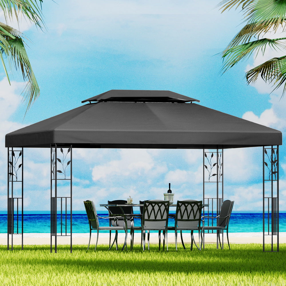 Grey outdoor gazebo canopy with ornate metal posts and open sides