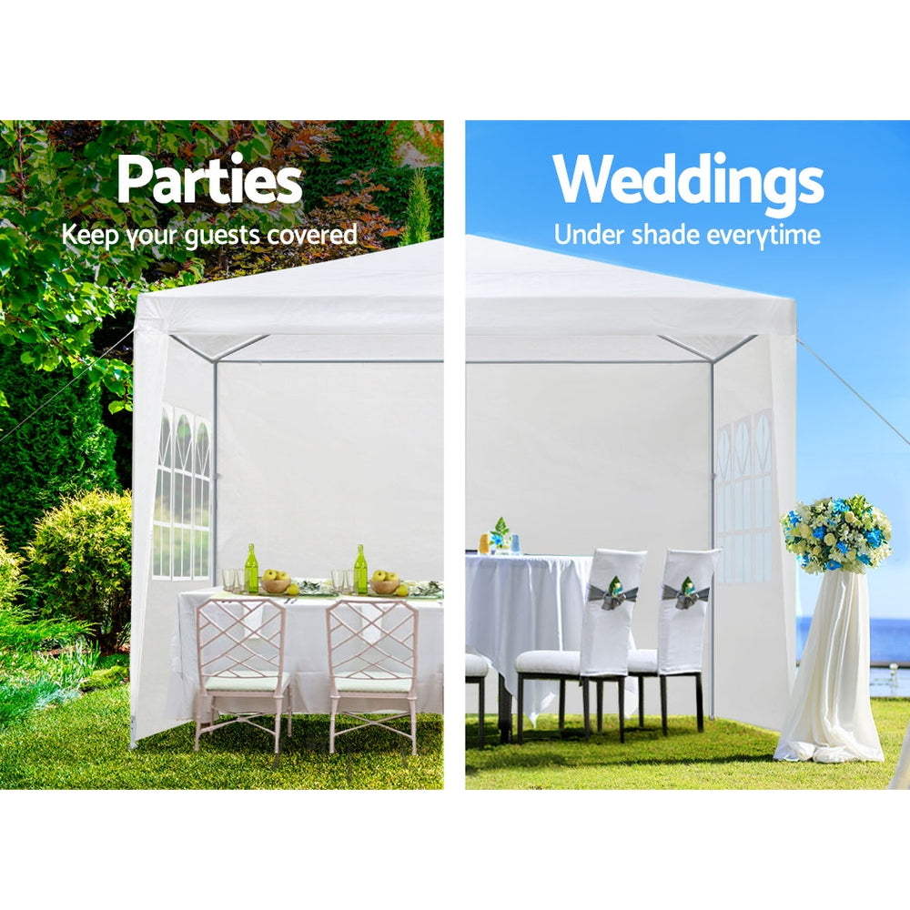 White gazebo tent with front side walls and table setting under the canopy