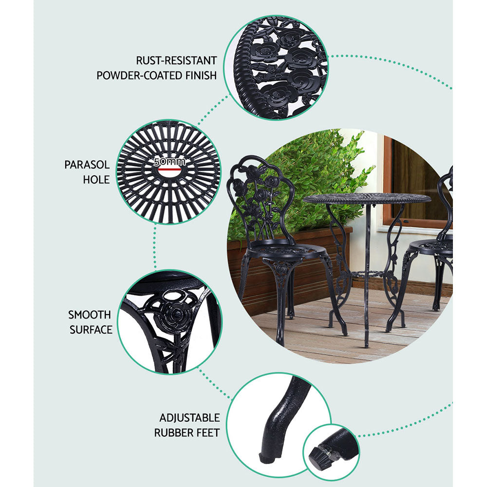 Black cast aluminum bistro set with rose-pattern chairs and round table with rubber feet
