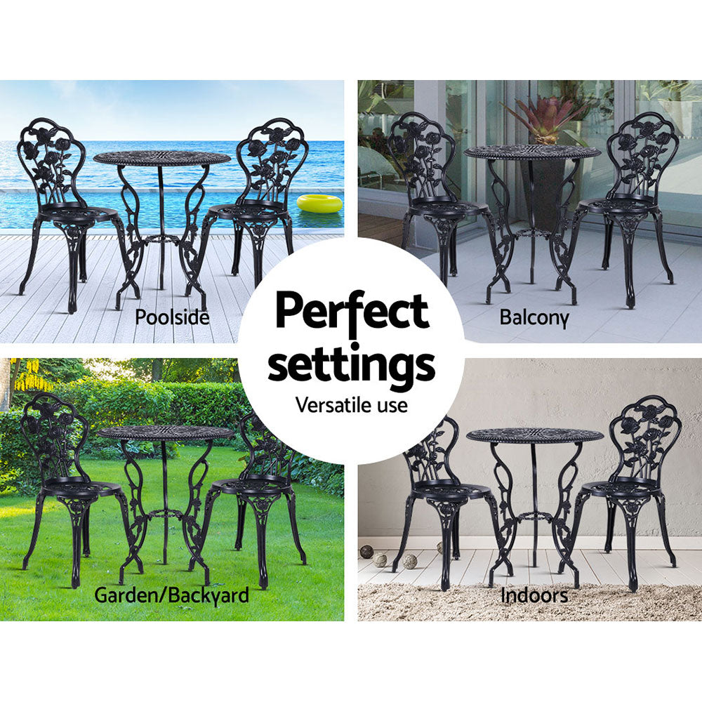 Black outdoor bistro set with round table and two rose-pattern chairs