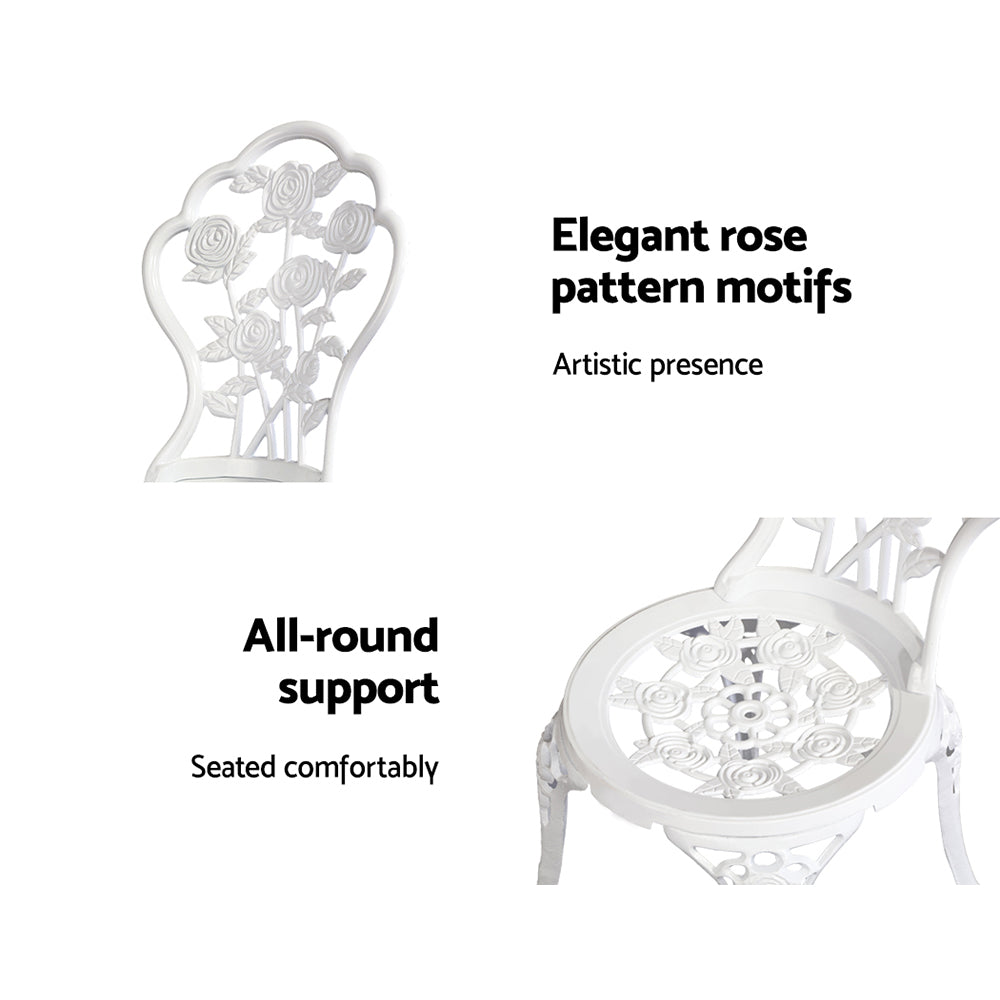 Ornate white cast-aluminum chair with rose-pattern backrest and cutout seat